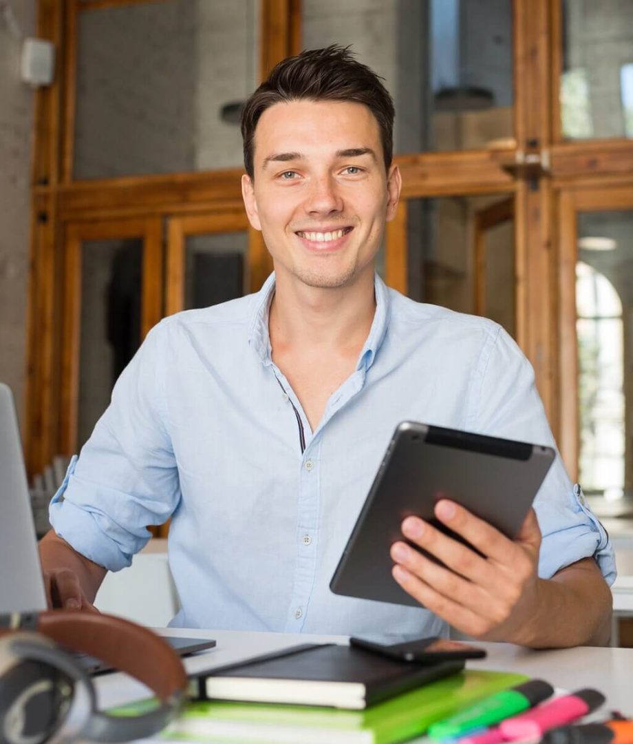 happy-young-confident-man-working-on-laptop-2023-11-27-04-58-31-utc